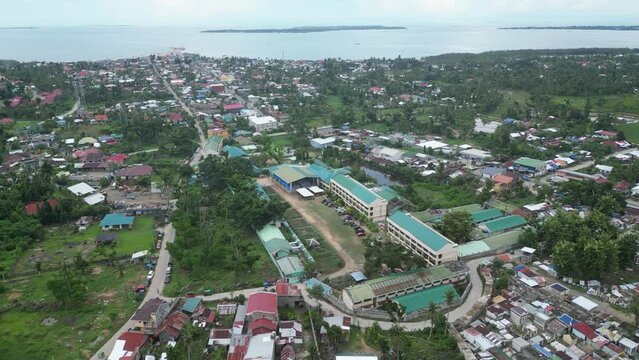 A town center and residential area near the sea in Bohol, Philippines. Aerial view.