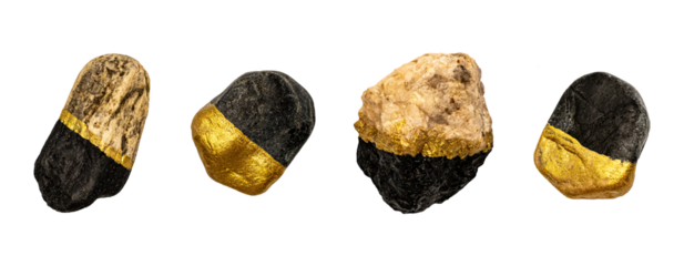 isolated set of black and gold painted rocks