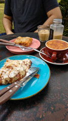 Creme Brulee Coffee, Sweet Cold White Coffee, and Croissant on the table in the cafe. Delicious breakfast.