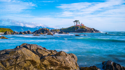 Battery Point Lighthouse and rocky bay at high tide in Crescent City, California. Long exposure...