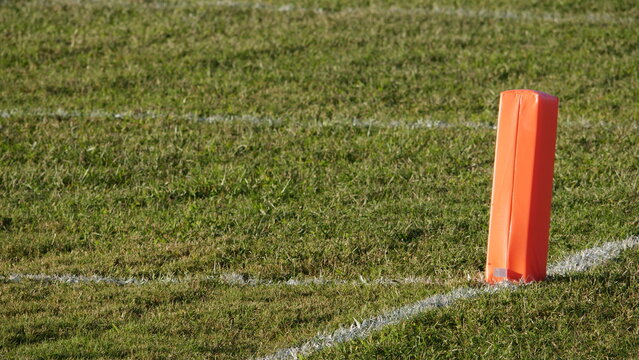 End Zone Pylon At High School Football Field During Late Afternoon