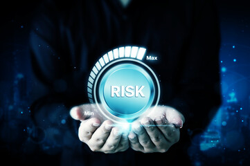 Risk management business strategy planning concept. Businessman hand holding risk level