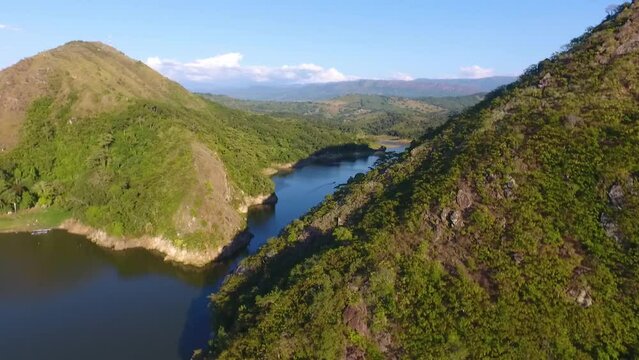 Aerial shot of the prado dam in tolima colombia over the mountains revealing the inland sea of colombia.
