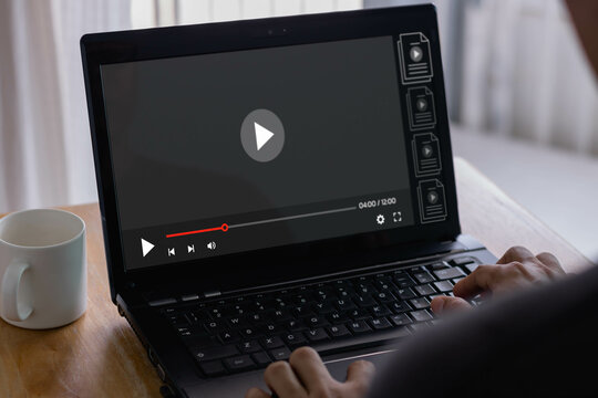 Video streaming online, live concert, show or tutorial, Businessman hands using laptop computer for streaming online, watching video on internet. Concept about subscription based live digital stream.