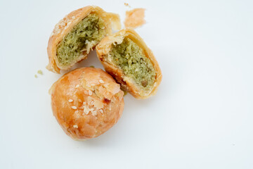 Indonesian local oven baked bread stuffed with green beans, with a crispy layered skin texture