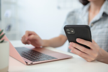 businesswoman holding smartphone. female using mobile phone connection, application, network. copy pace for text art work.