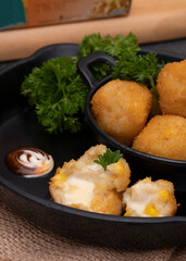 Bitterbalen is a food made from a mixture of wheat flour, liquid milk, cheese, ground beef, steamed potatoes and onions. Selective Focus. Close Up