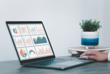 women using laptop or notebook computer with data analysis graph dashboard, confident woman working...