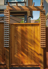 New wood fence gate door. New Wooden Gateway Background. Newly built fence gate
