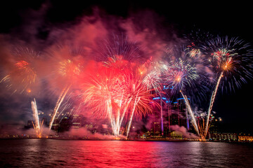 White Fireworks going off during the Detroit Ford Fireworks as seen from the riverwalk in Windsor, Ontario