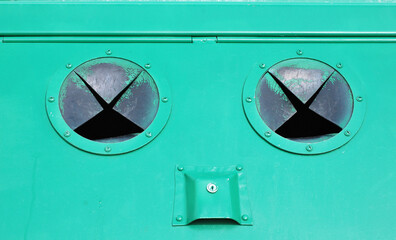 Recycle bins displayed outside.