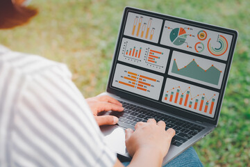 woman using laptop or notebook computer with data analysis graph dashboard, confident woman working with computer laptop concept, contact idea design dashboard graph business conceptual.