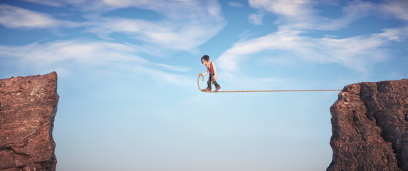 Man walks on a rope between two peaks. Confidence and journey concept.