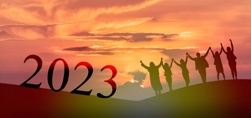Happy new year 2023, Keep fighting together, Silhouette of 2023 letters on the mountain with...