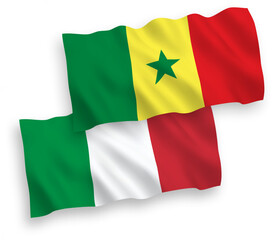 National vector fabric wave flags of Italy and Republic of Senegal isolated on white background. 1 to 2 proportion.