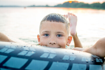 Fototapeta na wymiar Rest on vacation. Bathing. Child at Lake Myastro