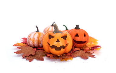 Halloween trick or treat. Pumpkin head Jack-o'-lantern on a pile of maple leaves isolated on white background.
