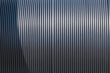 Background and texture of black fiber optic cable in single mode type on large wooden coil reel
