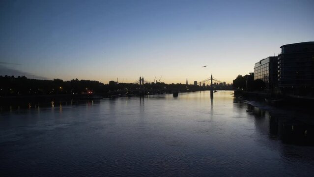 London Thames dawn skyline from Battersea with birds 4K