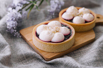 Dessert basket with blueberries jam on wooden tray