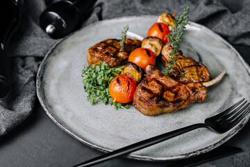 Delicious grilled pork chop on plate