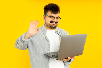 Concept of people, young fat man with laptop on yellow background