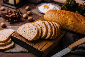 sliced bread on board and flour with fresh egg