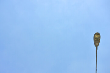 Street light lamp post led with panel system on the road with blue sky.