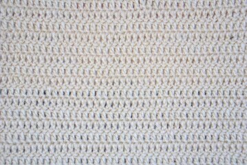 Handmade crochet knitted stitched yarn soft tender fiber fabric craft abstract wallpaper background...