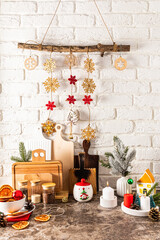 ceramic, wooden objects and decorations for the new year made of eco materials. vertical view of the part of the kitchen, decorated for the holiday.