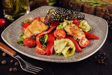 chicken salad with vegetables on a plate
