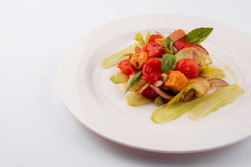 warm salad of stewed cherry tomatoes, cucumbers and croutons