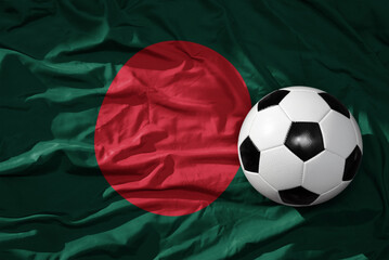 vintage football ball on the waveing national flag of bangladesh background. 3D illustration