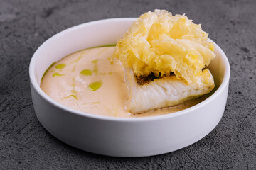 fried cod fish filet with sauce hollandaise