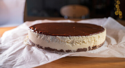 Close up of a Chocolate cake decorated with flaked coconut, homemade pie dessert, selective focus