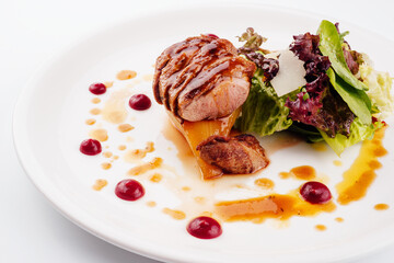 Slices of grilled duck breast fillet with salad