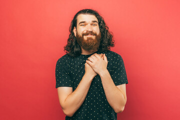 Portrait of charming bearded man wishing for something