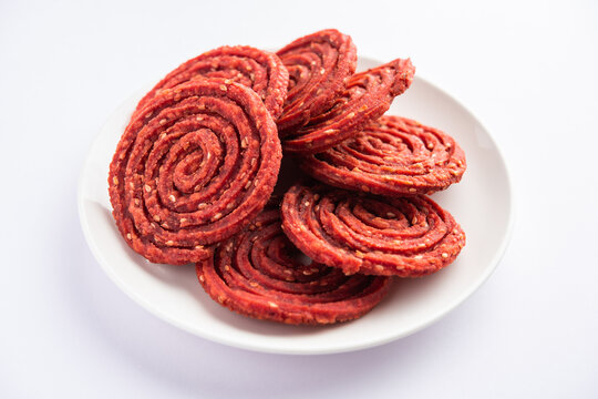 Beatroot chakli, murukku, Beetroot chakli, a spiral fried snack from India made in Diwali festival
