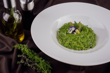 Obraz na płótnie Canvas Dish of risotto with asparagus closeup