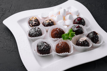 Boxes with tasty chocolate candies with marshmallow