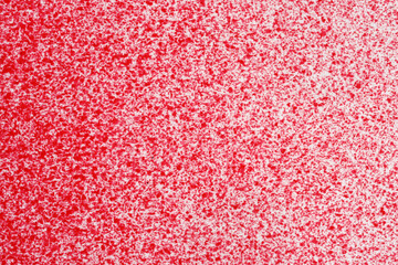 macro photography of red spray paint on white paper