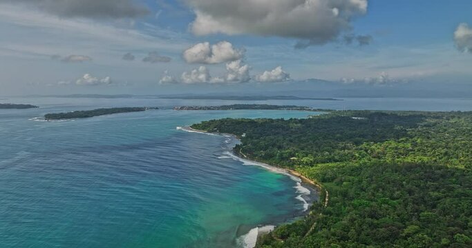 Bocas del Toro Panama Aerial v6 dolly in flyover paunch beach towards big creek capturing beautiful turquoise blue seascape and tropical forest - Shot with Mavic 3 Cine - April 2022