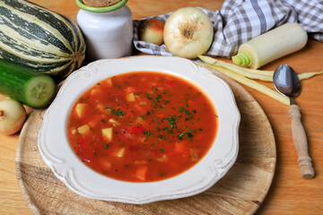 Fototapeta Red vegetable soup on a plate. obraz