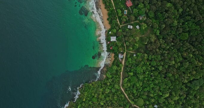 Bocas del Toro Panama Aerial v4 vertical top down view, drone flyover along coastal shore capturing paunch beach peninsula, turquoise blue sea and tropical forest - Shot with Mavic 3 Cine - April 2022