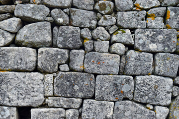 Wall formed by carved granite blocks