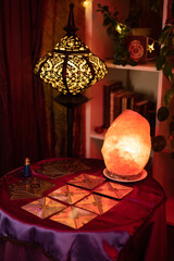 room decorated with esoteric elements, such as tarot cards, salt lamps and so on.