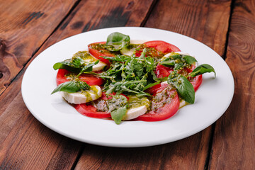Traditional italian caprice salad tomato, mozzarella cheese and basil