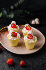 Beautiful pavlova cakes with strawberries and raffaello