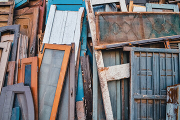 Fototapeta na wymiar Rustic Wood Garbage Pile Background: A Snapshot of Weathered and Decaying Waste Materials