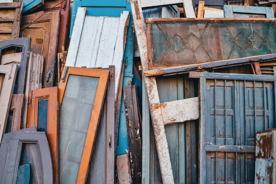 Rustic Wood Garbage Pile Background: A Snapshot of Weathered and Decaying Waste Materials